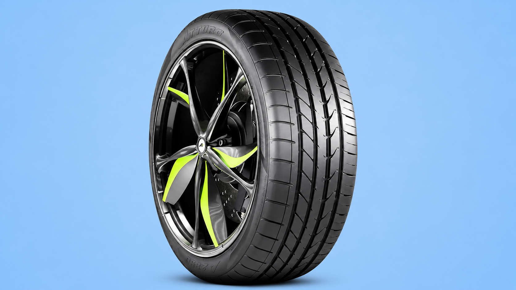 An Atturo performance tire mounted on a custom black and lime green rim against a blue background.