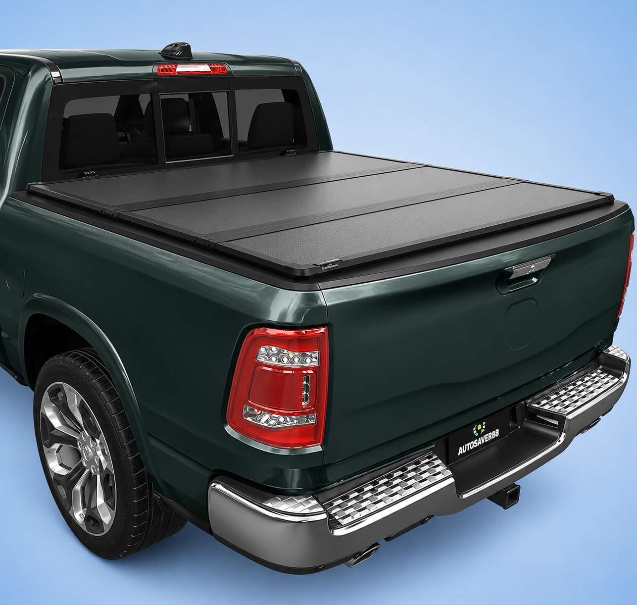 A dark green Ram 1500 truck with a closed Autosaver88 tonneau cover on a blue background.