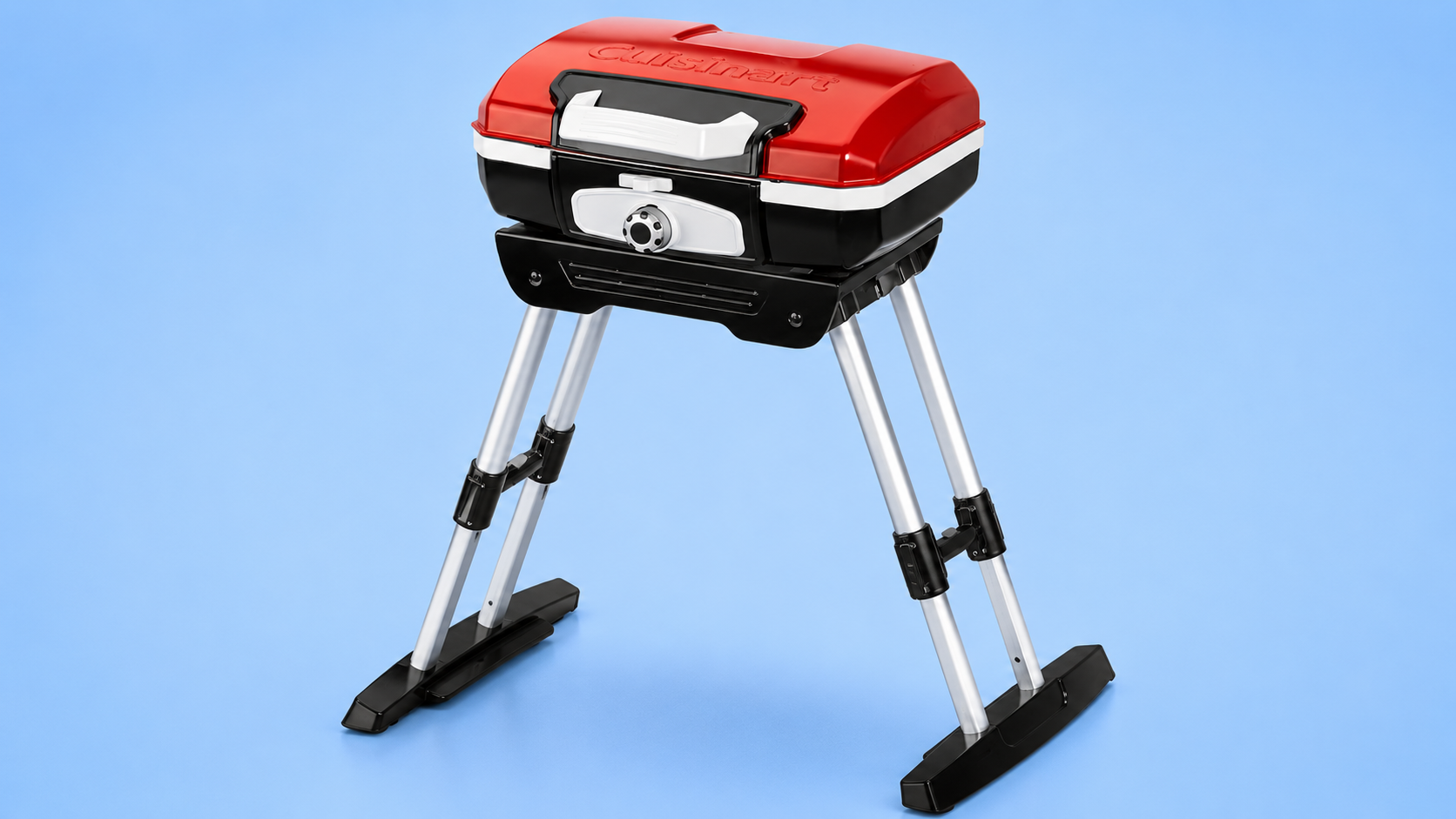 A red and black Cuisinart portable gas grill on an adjustable telescoping stand against a blue background.