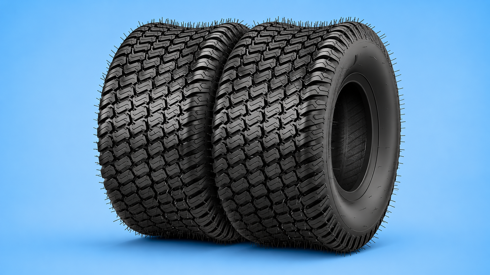 A pair of black turf tires designed for lawn mowers showing their tight block tread pattern against a blue background.