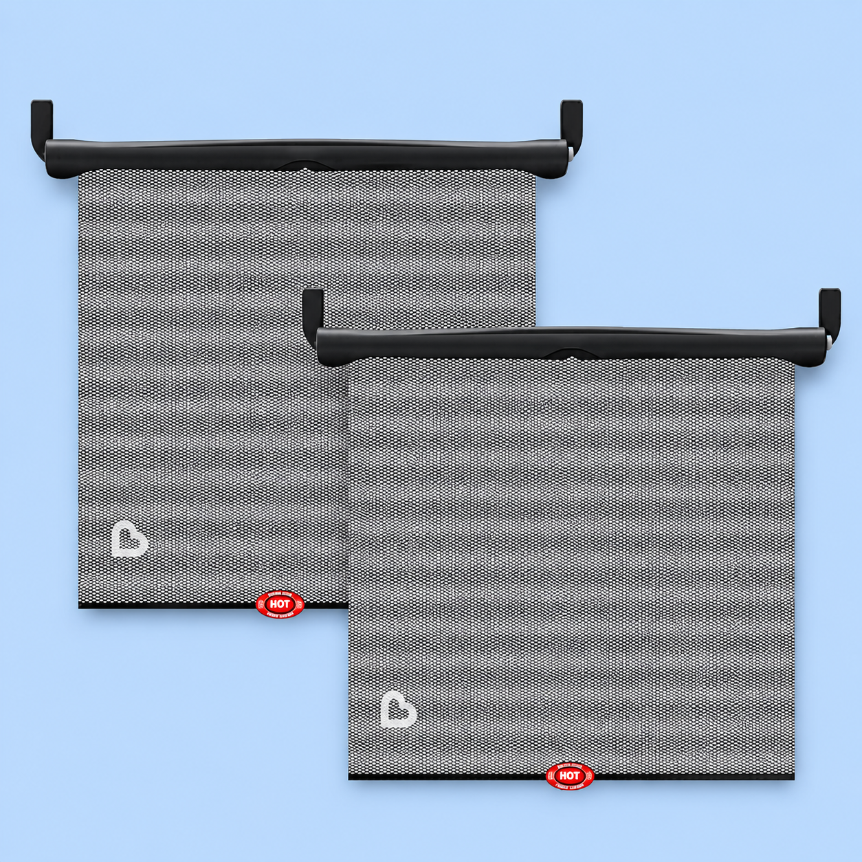 Two Munchkin Brica roller car sun shades for windows on a blue background.