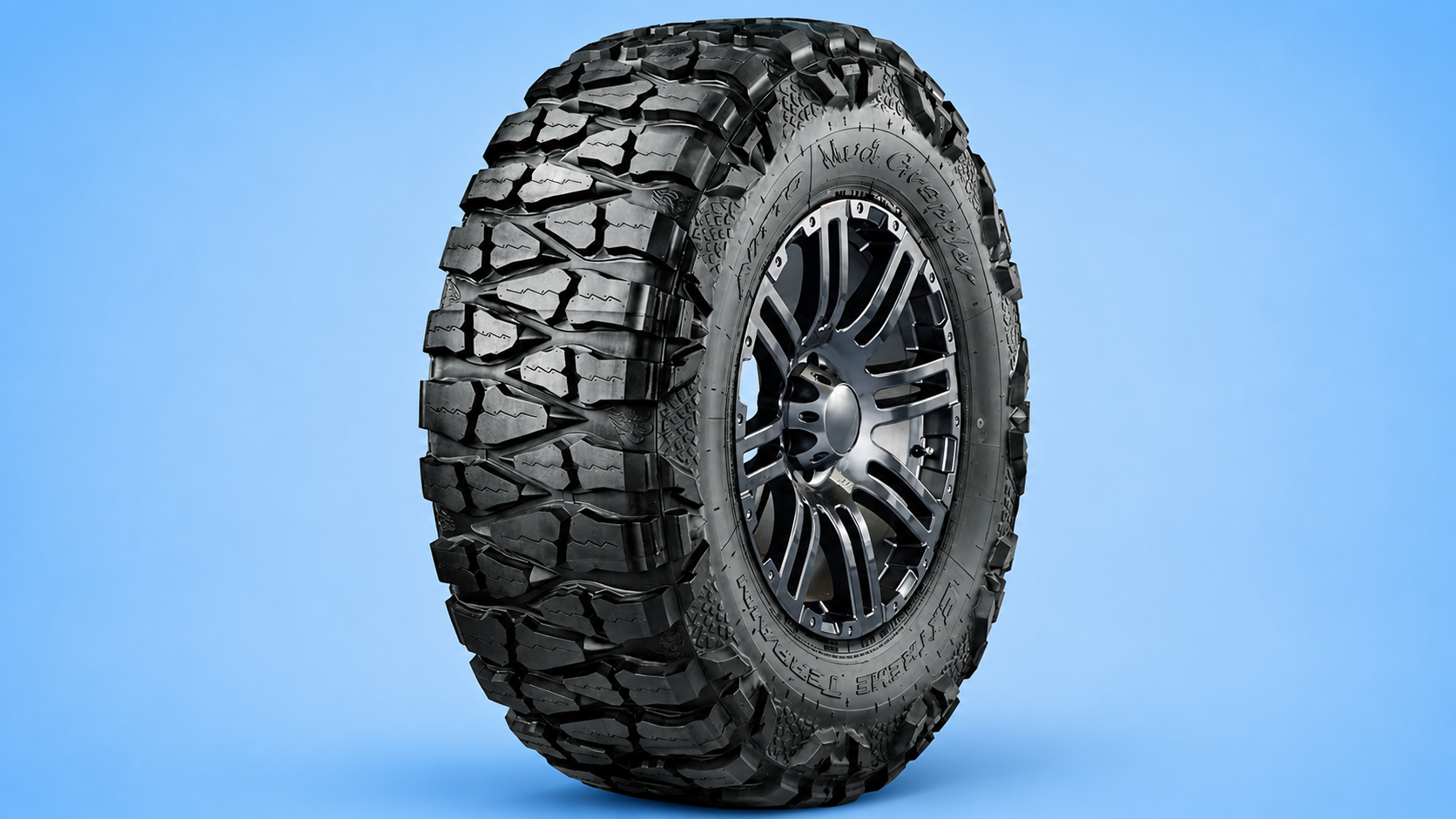 A Nitto Mud Grappler extreme terrain tire mounted on a rugged black rim against a blue background.