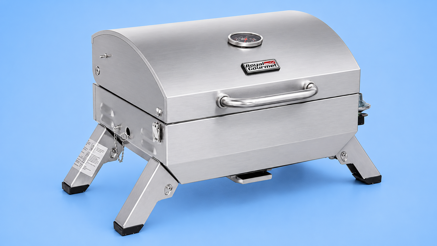 A Royal Gourmet portable stainless steel tabletop gas grill against a blue background.