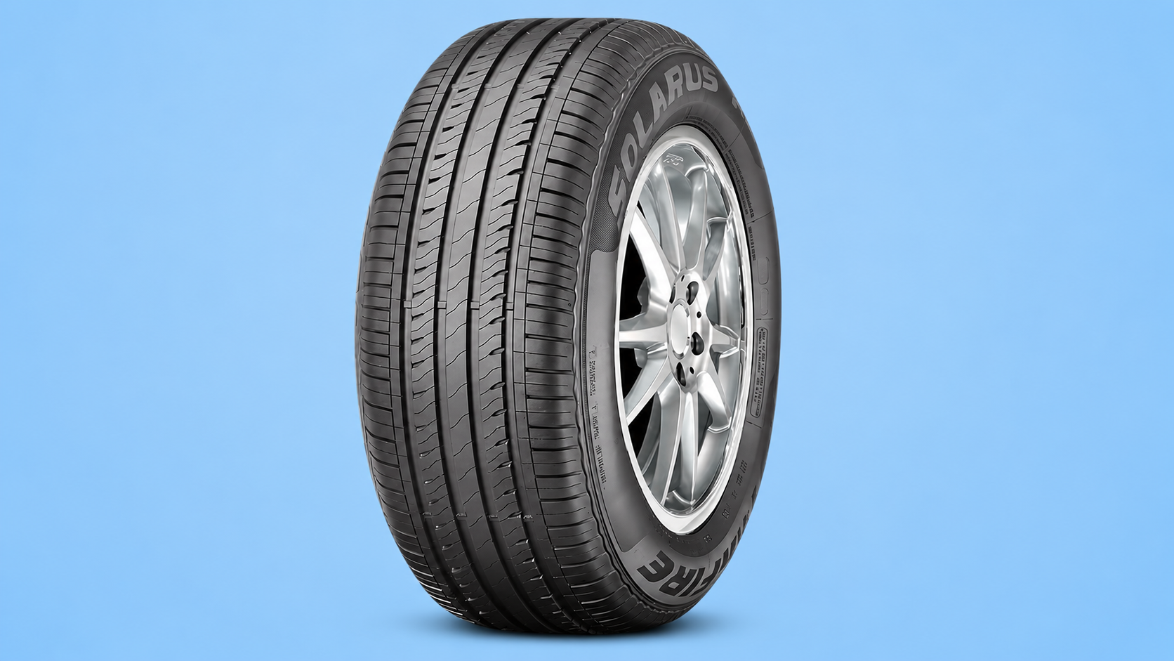 A Starfire Solaris car tire mounted on a silver rim against a blue background.