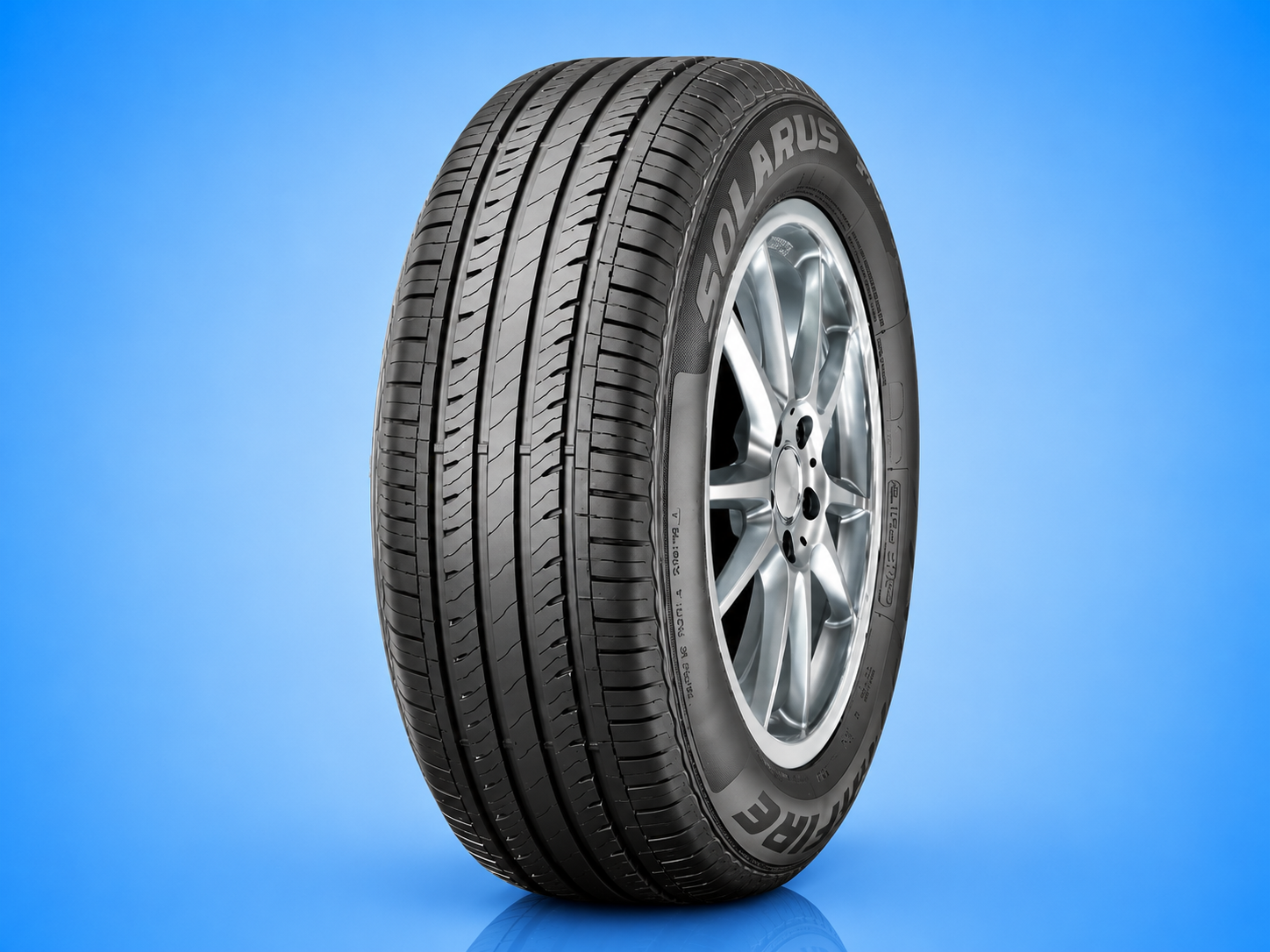 Starfire Solarus all-season passenger car tire mounted on a silver rim against a solid blue background.
